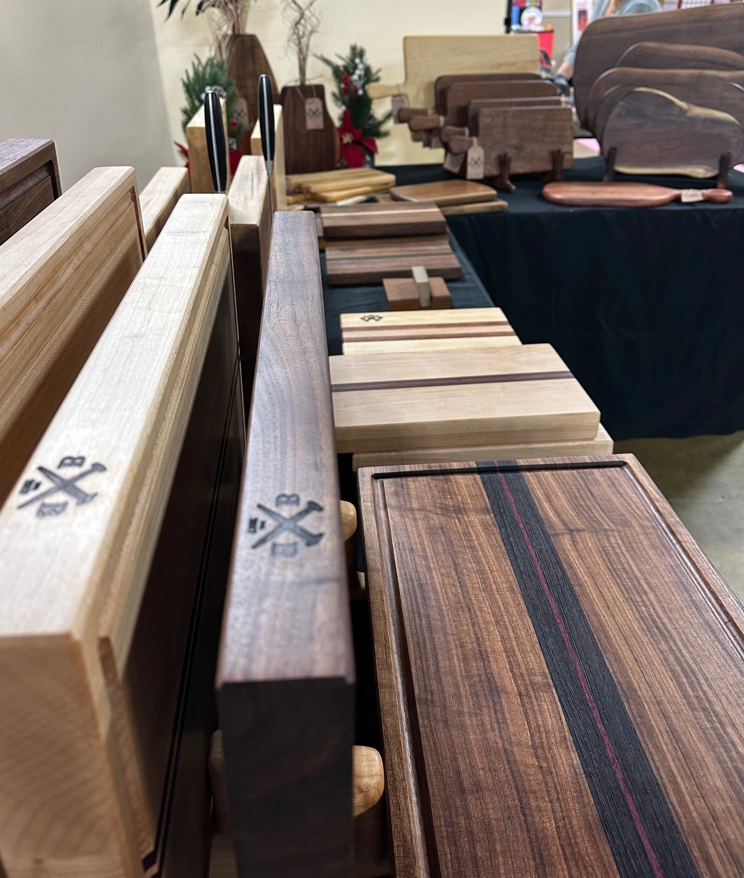 BonoBlocks - Cutting boards displayed on table at market