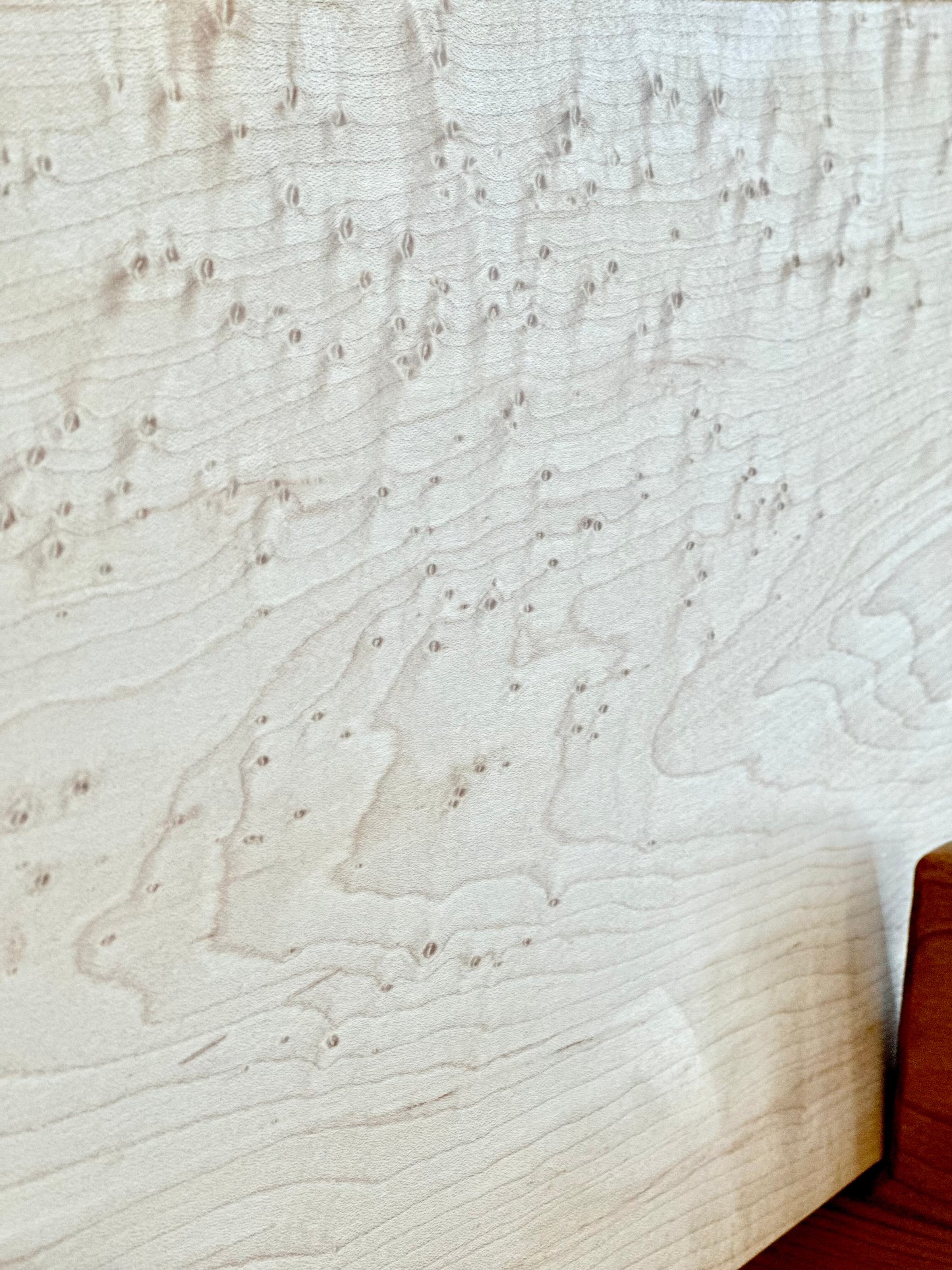 Close-up detail of Birdseye maple figure on Bonobuilt charcuterie board No. 009 — handcrafted in Visalia, California
