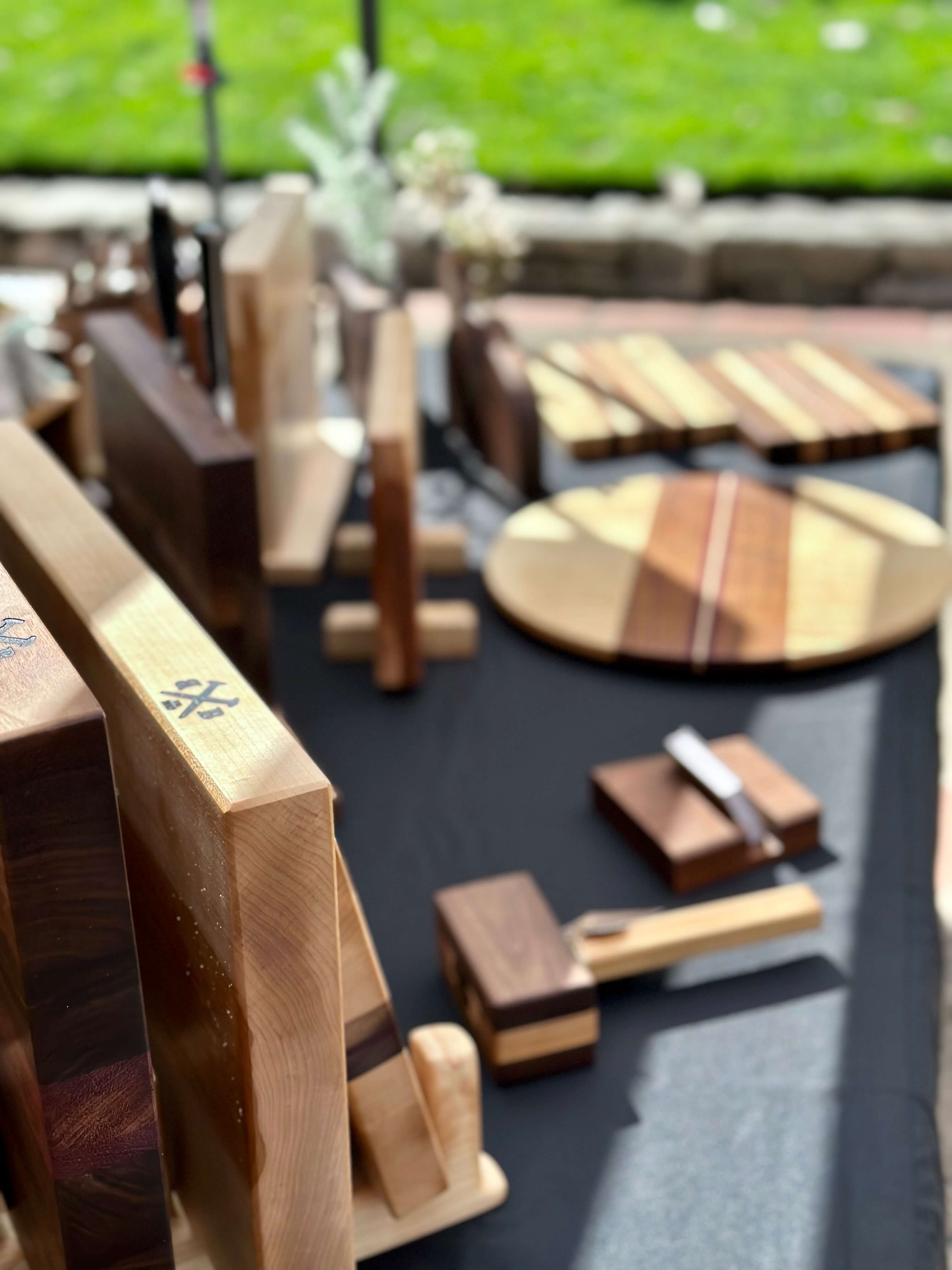 handmade serving boards and cutting boards on table display